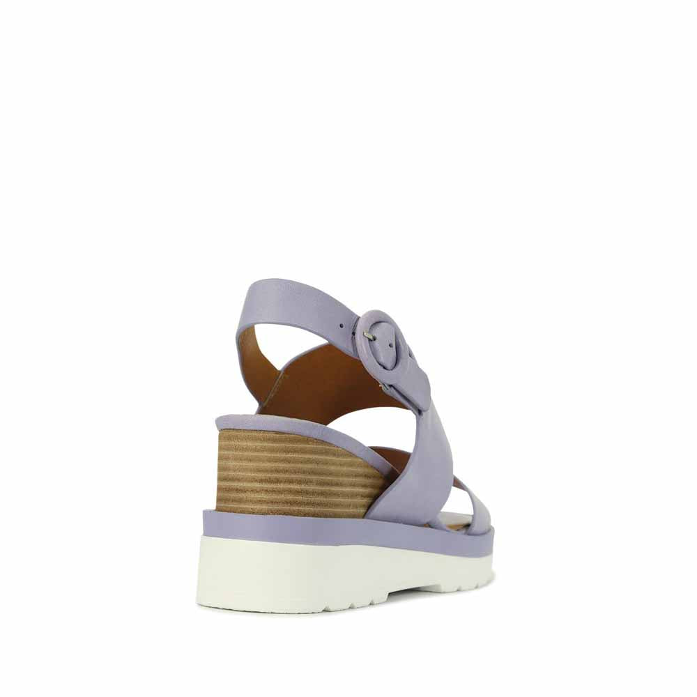 Eos Jades Lilac sandals with open-toe design and ankle straps, featuring a soft lilac color and stylish comfort.