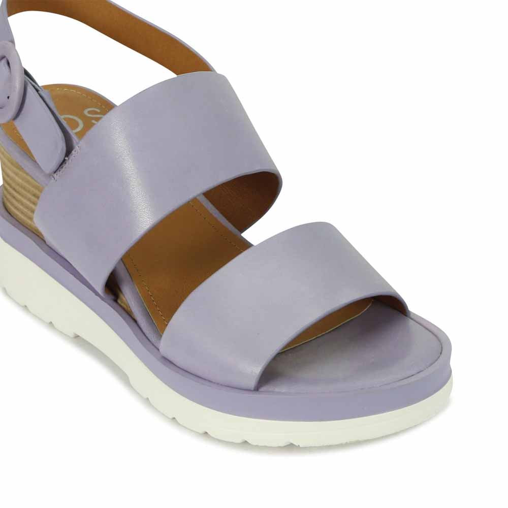 Eos Jades Lilac sandals with open-toe design and ankle strap, showcasing soft lilac color and stylish strap details.