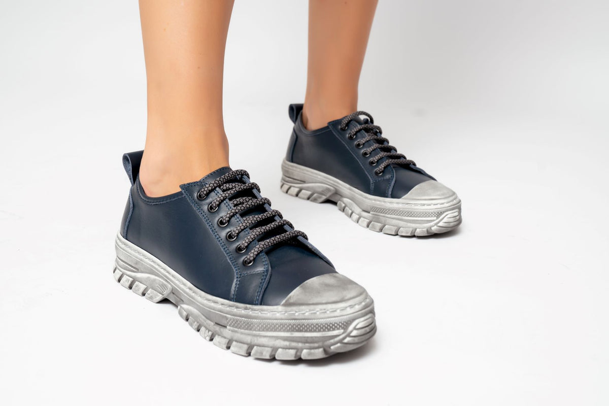 Le Sansa Rocky DK Navy sneakers with navy blue design and white sole, stylish casual footwear for men.
