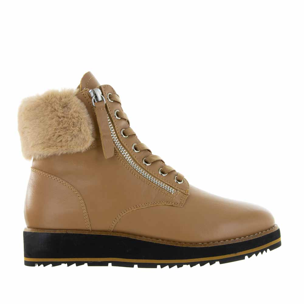 Le Sansa Lesansa Snap Tan boots with stylish design and tan leather finish, showcasing a close-up view of the footwear.