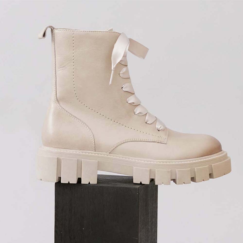 Eos Febe Stone boots featuring a stylish design with a textured stone pattern and ankle-high silhouette.