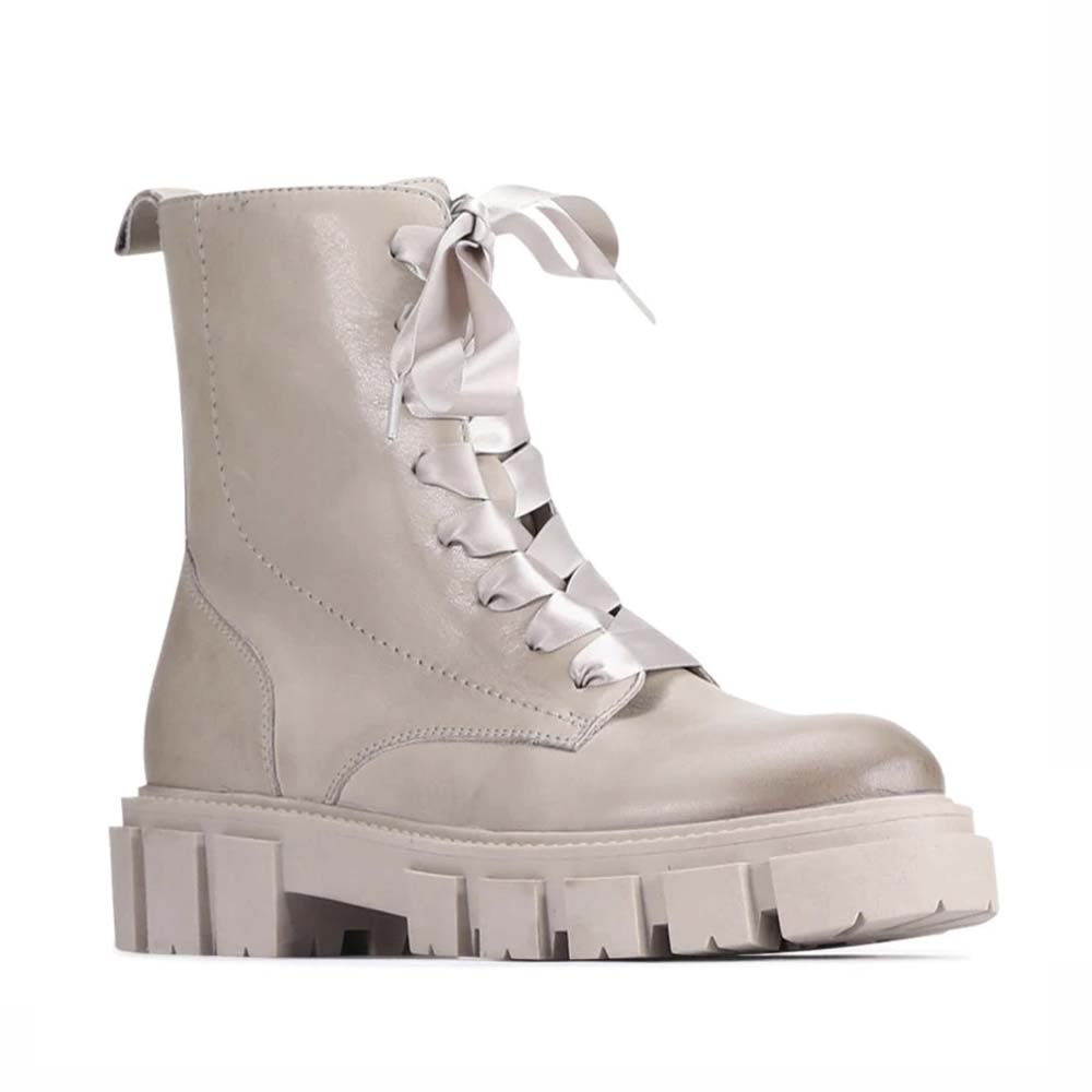 Eos Febe Stone boots featuring a sleek design and neutral color, perfect for stylish everyday wear.