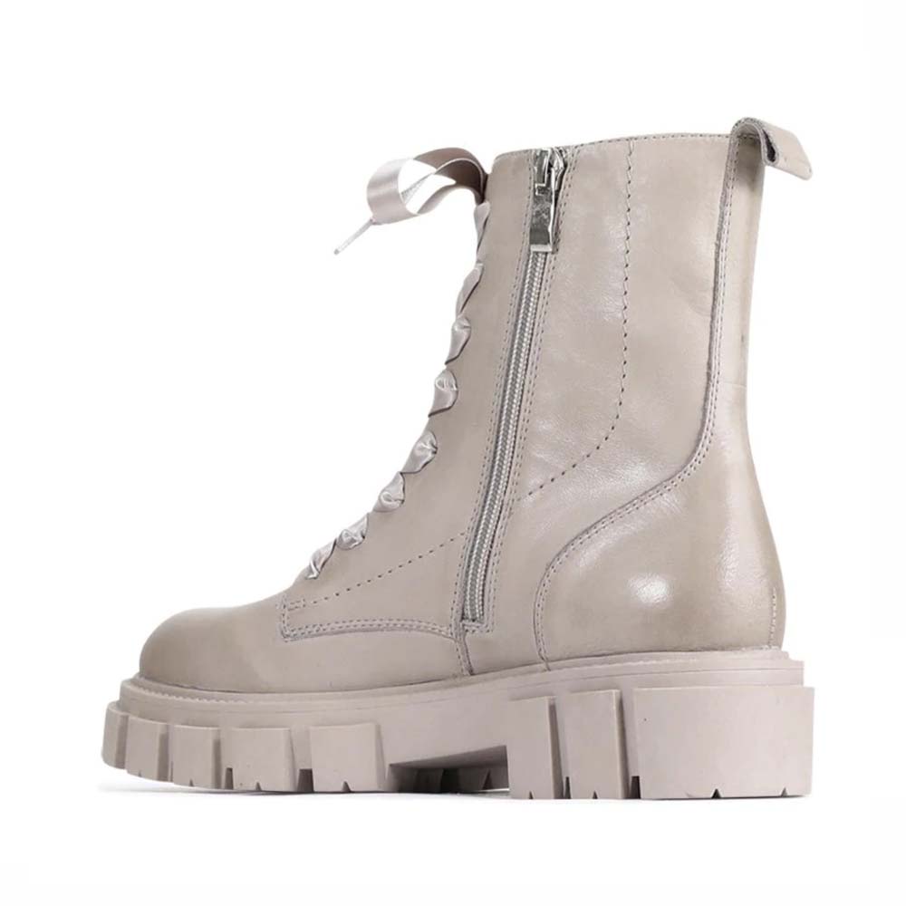 Eos Febe Stone boots in beige with chunky sole and stylish design, featuring lace-up front and decorative stitching.
