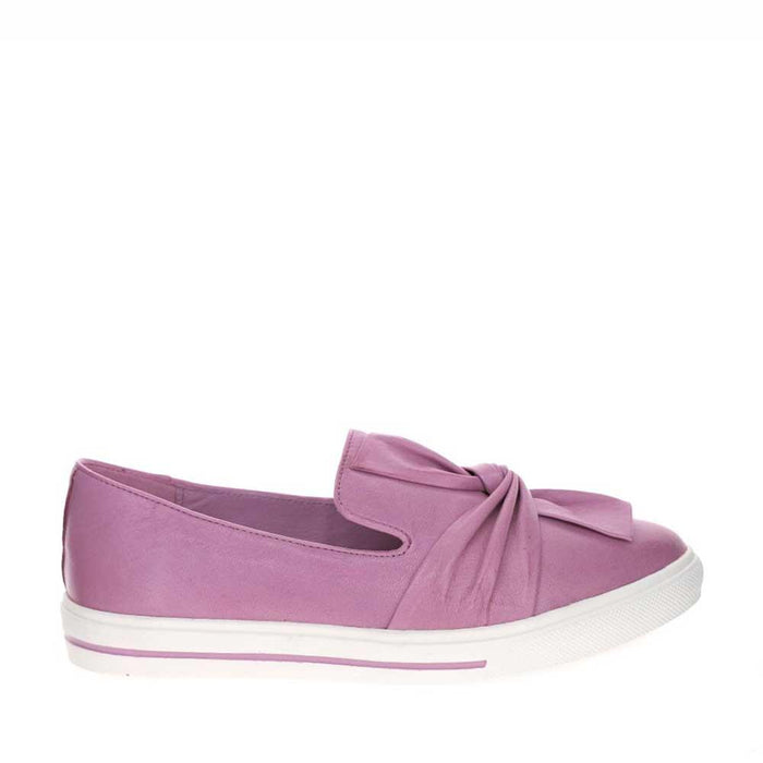Le Sansa Izzy Lilac slip-on shoes with a sleek design and soft fabric upper, shown in a close-up view.
