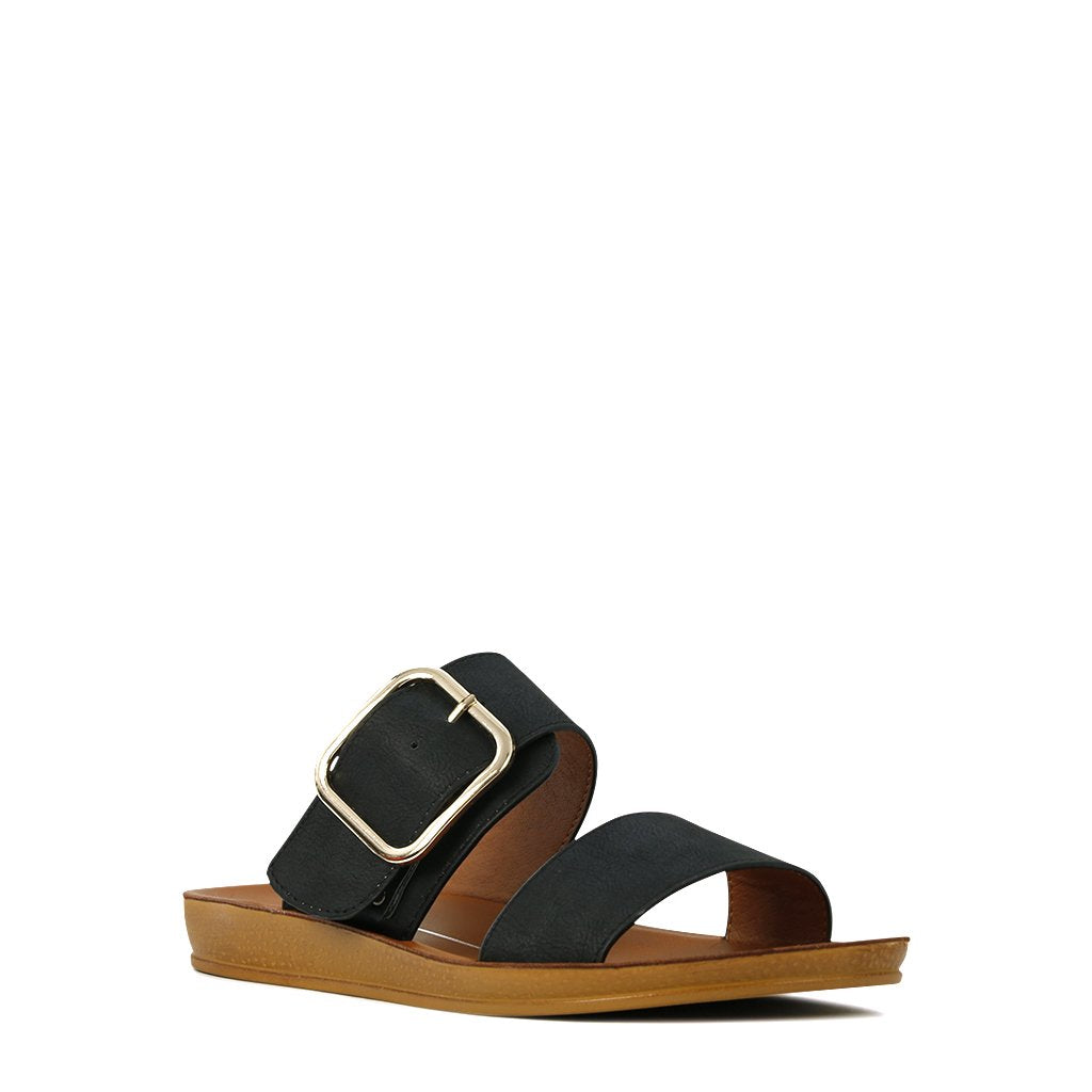 Black LOS CABOS DOTI flats with a sleek design, featuring a pointed toe and stylish dotted pattern, perfect for casual and dressy wear.