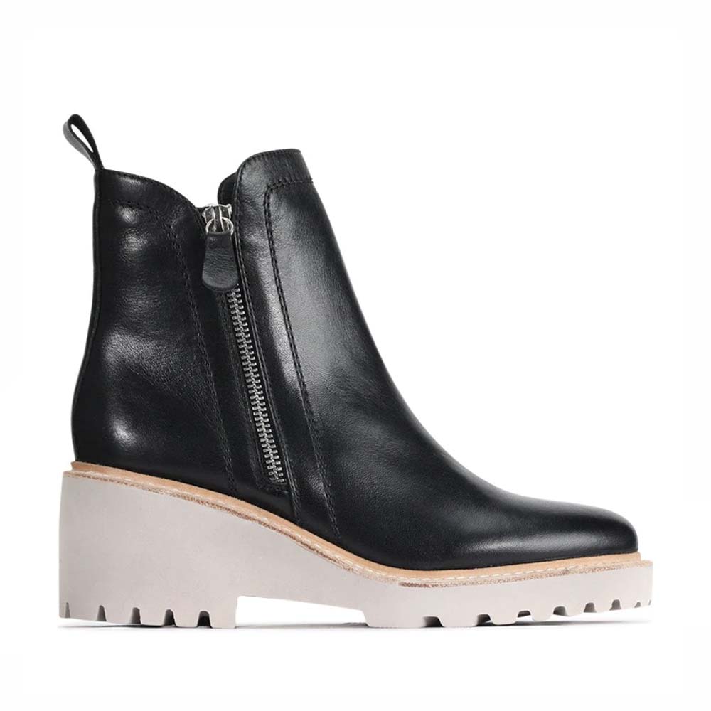 Eos Parson Black boots with sleek design, ankle height, and lace-up front, showcasing stylish footwear for casual or formal wear.