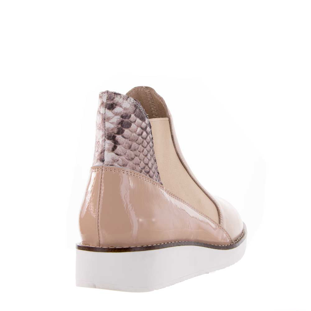Le Sansa Rally Blush Rosegold boots featuring a sleek design and blush pink rosegold finish, shown from the side view.