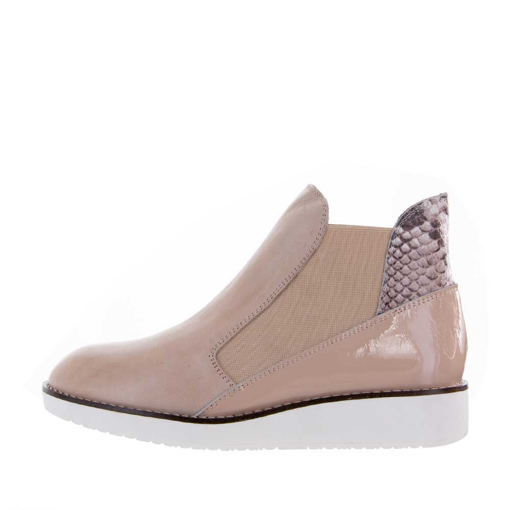 Le Sansa Rally Blush Rosegold boots featuring a sleek design and stylish rose gold color, displayed on a neutral background.