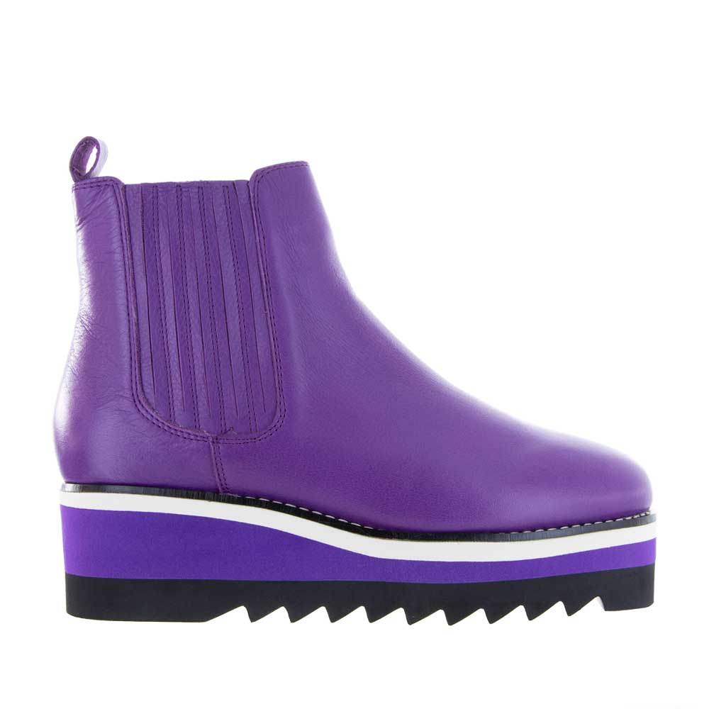 Le Sansa Trinity Violet boots with ankle-high design, purple color, and stylish laces, perfect for casual and chic outfits.