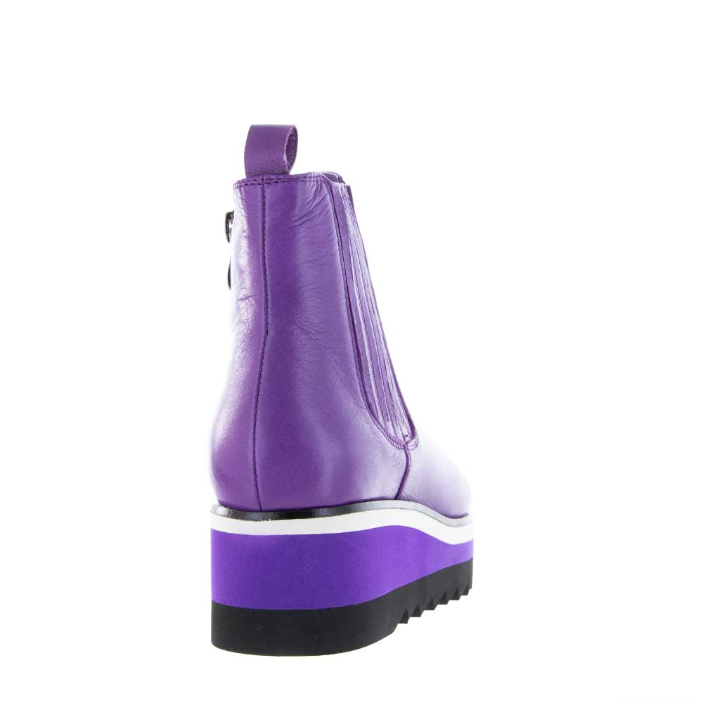 Le Sansa Trinity Violet boots showing a stylish pair of ankle boots with violet color and sleek design.