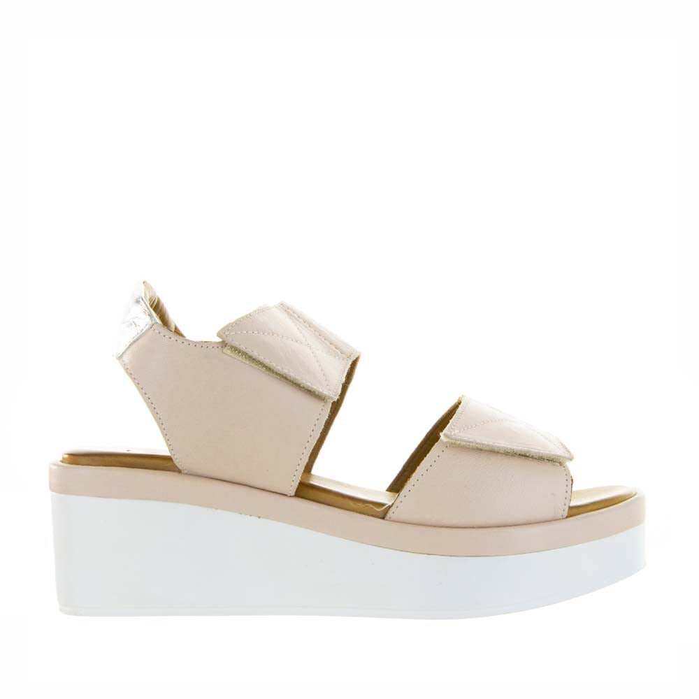 Le Sansa Tristen Cameo sandals featuring a beige strappy design and low heel, perfect for casual or dressy summer outfits.