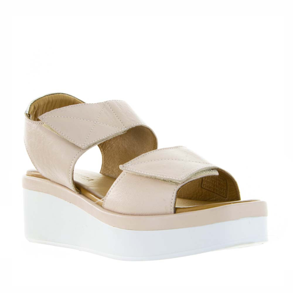 Le Sansa Tristen Cameo sandals with beige straps and ankle buckle, showcased on a neutral background.